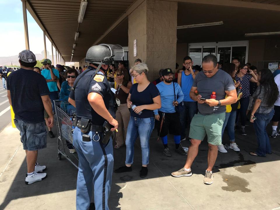 Police interview witnesses to the shooting near Cielo Vista Mall in El Paso on Aug. 3, 2019.