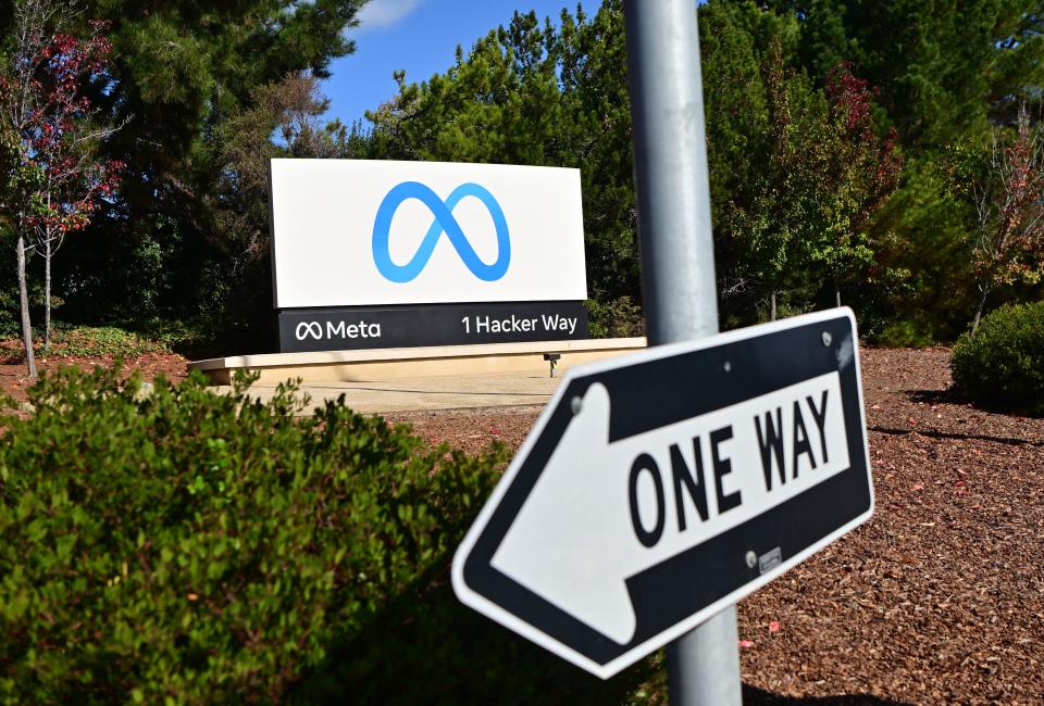 A one way sign is seen in front of Meta (formerly Facebook) corporate headquarters in Menlo Park, California on November 09, 2022. - Facebook owner Meta will lay off more than 11,000 of its staff in 