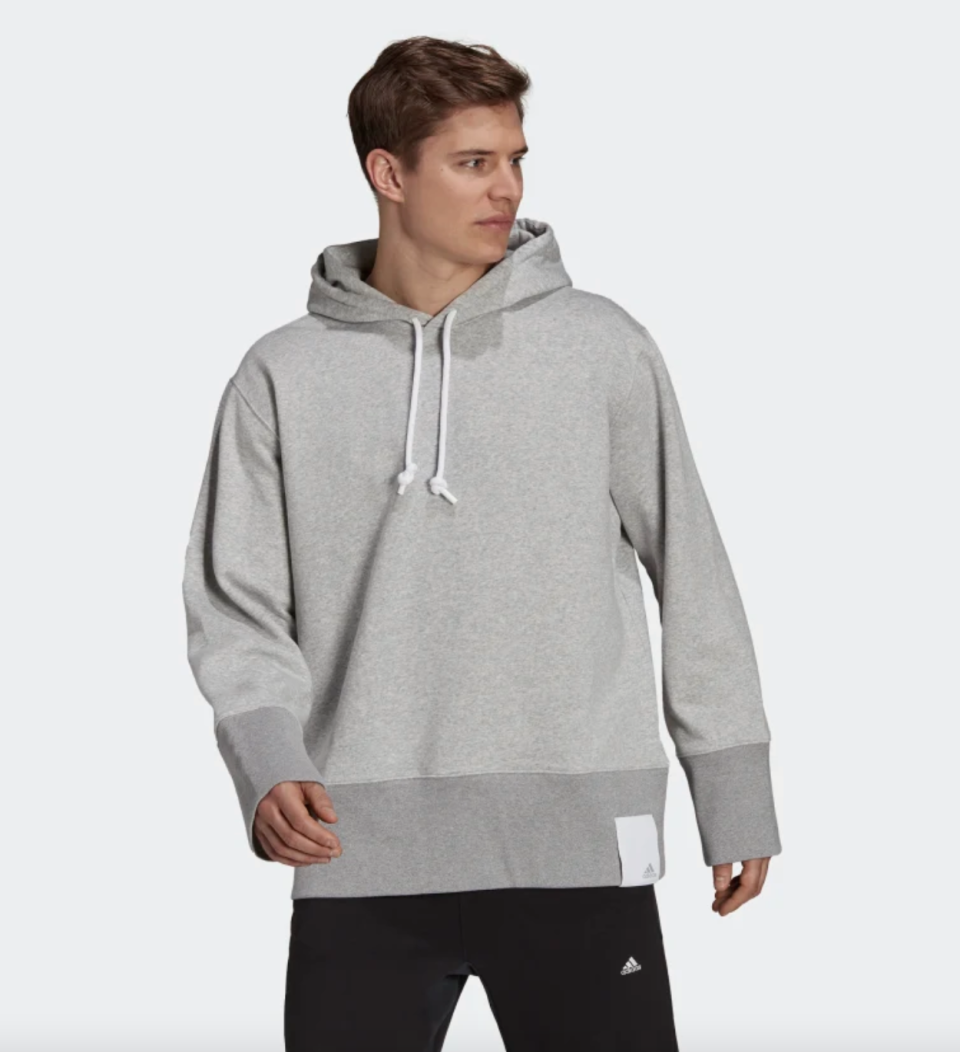 Sportswear Comfy and Chill Fleece Hoodie in grey with black jogger pants (Photo via Adidas)