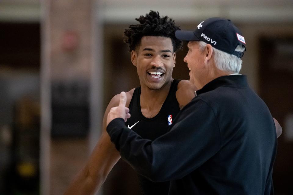 Jazz forward Ochai Agbaji talks to CEO Danny Ainge during a Utah Jazz practice at the Zions Bank Basketball Campus.