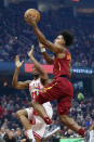 Cleveland Cavaliers' Collin Sexton (2) goes up for a shot against Chicago Bulls' Thaddeus Young (21) in the first half of an NBA basketball game, Saturday, Jan. 25, 2020, in Cleveland. (AP Photo/Ron Schwane)