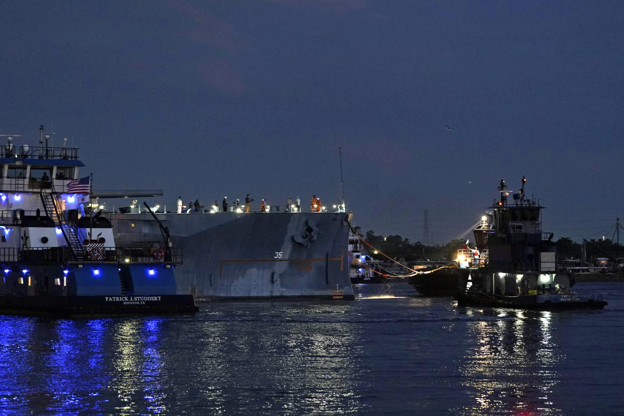 The USS Texas is tied to a tugboat Wednesday, Aug. 31, 2022, in La Porte, Texas. The vessel, which was commissioned in 1914 and served in both World War I and World War II, is being towed down the Houston Ship Channel to a dry dock in Galveston where it will undergo an extensive $35 million repair. (AP Photo/David J. Phillip)