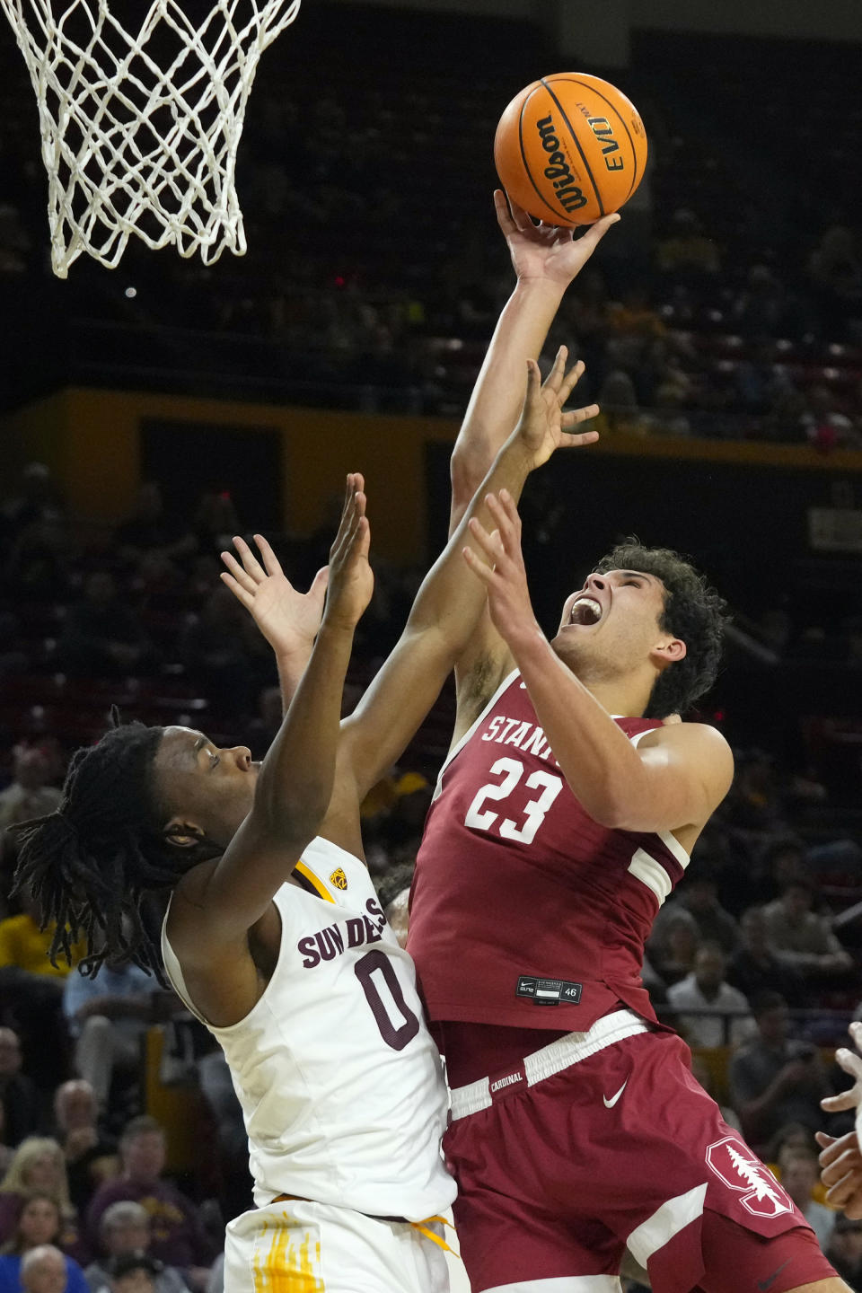 Stanford Cardinal forward Brandon Angel (23) gets off a shot over Arizona State guard Kamari Lands (0) during the first half of an NCAA college basketball game Thursday, Feb. 1, 2024, in Tempe, Ariz. (AP Photo/Ross D. Franklin)