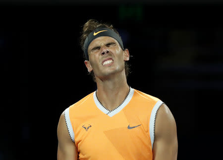 Tennis - Australian Open - Men's Singles Final - Melbourne Park, Melbourne, Australia, January 27, 2019. Spain's Rafael Nadal reacts during the match against Serbia's Novak Djokovic. REUTERS/Aly Song