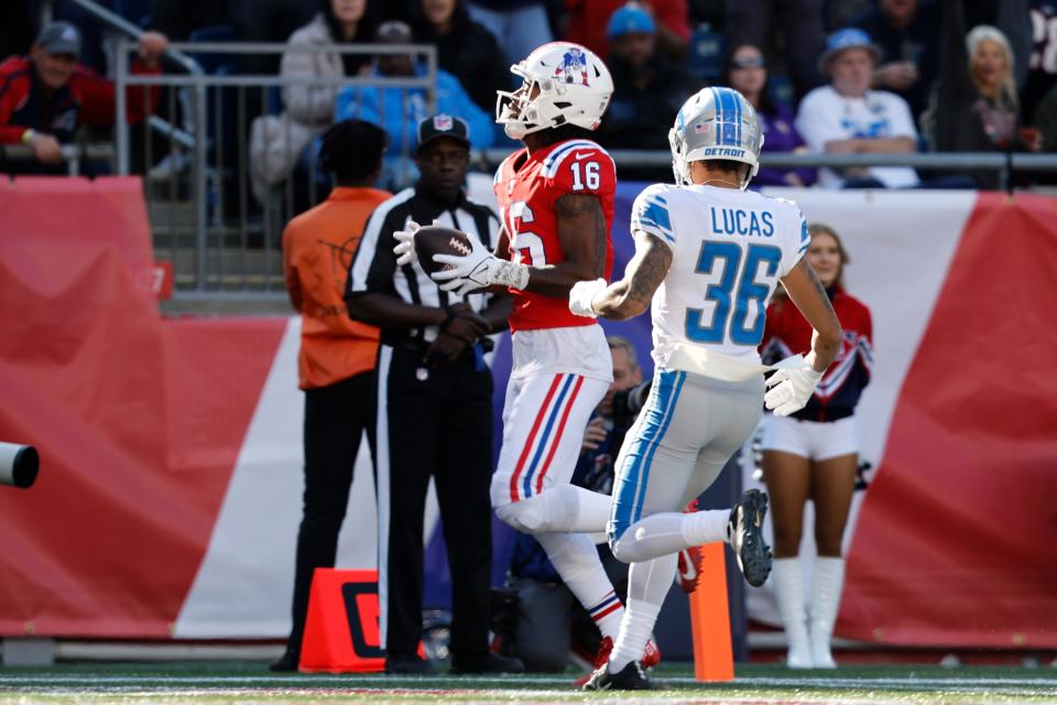 Patriots wide receiver Jakobi Meyers (16) runs into the end zone for a touchdown as Lions cornerback Chase Lucas (36) tries to defend in the second half Sunday, Oct. 9, 2022, in Foxborough, Mass.