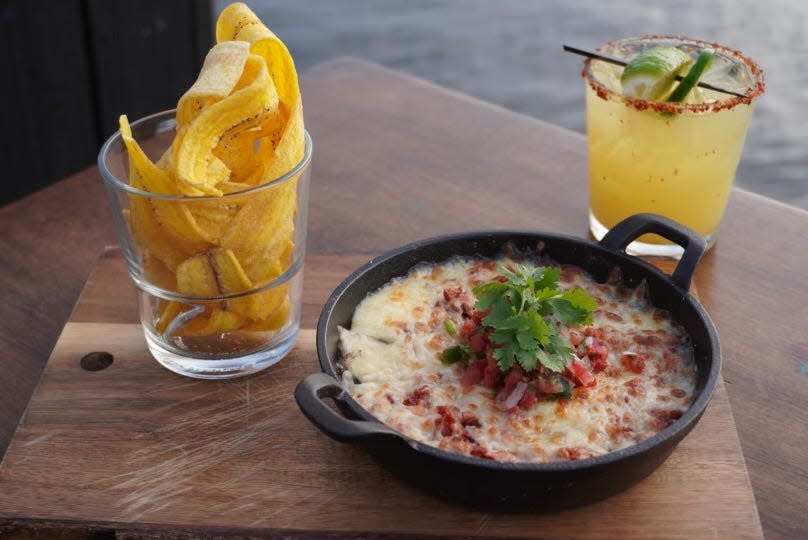 The baked chorizo & black bean dip includes chihuahua cheese, salsa Fresca and crispy plantain chips.