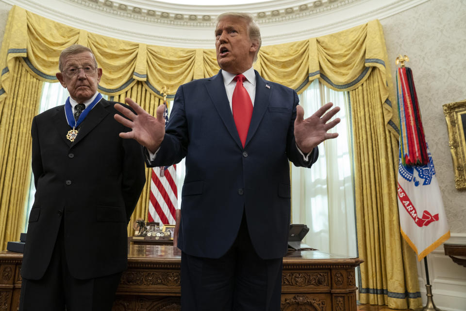 President Donald Trump speaks during a ceremony to present the Presidential Medal of Freedom to former football coach Lou Holtz, in the Oval Office of the White House, Thursday, Dec. 3, 2020, in Washington. (AP Photo/Evan Vucci)