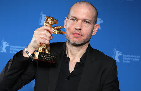 Nadav Lapid poses with Golden Bear for Best Film for Synonyms, after the awards ceremony at the 69th Berlinale International Film Festival in Berlin, Germany, February 16, 2019. Christoph Soeder/Pool via Reuters