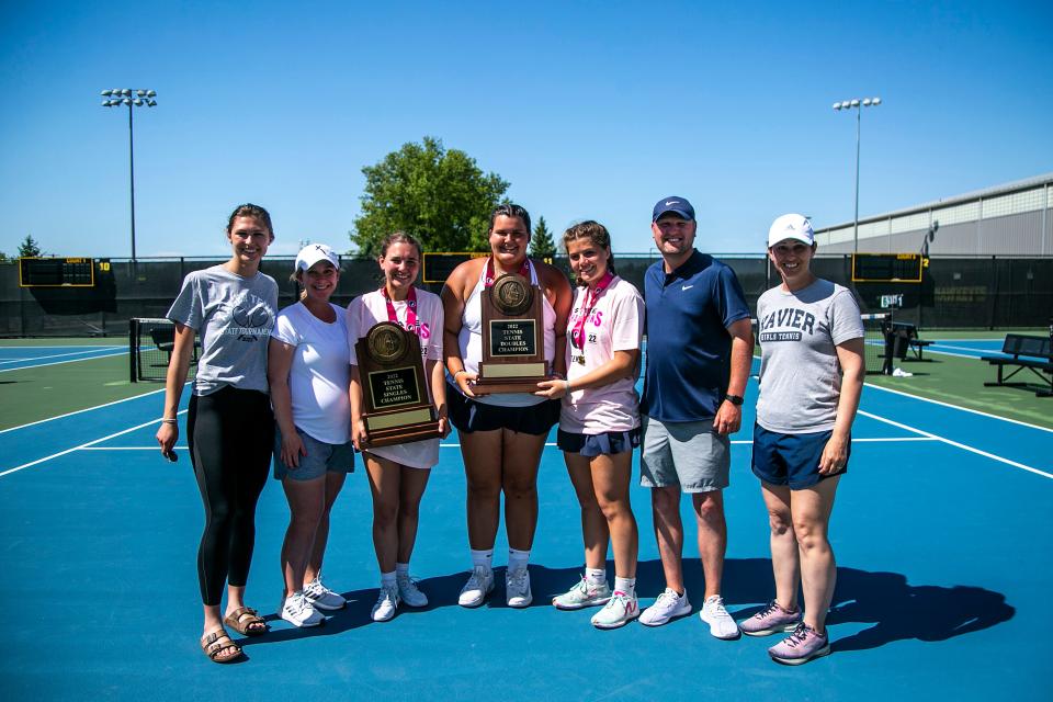 Cedar Rapids Xavier singles champion Ella Tallett, third from left, doubles champions Courtney Carstensen and Ally Burger pose for a photo with their coaches after the Class 1A high school girls state tennis tournament on May 28 at the Hawkeye Tennis and Recreation Complex in Iowa City, Iowa.