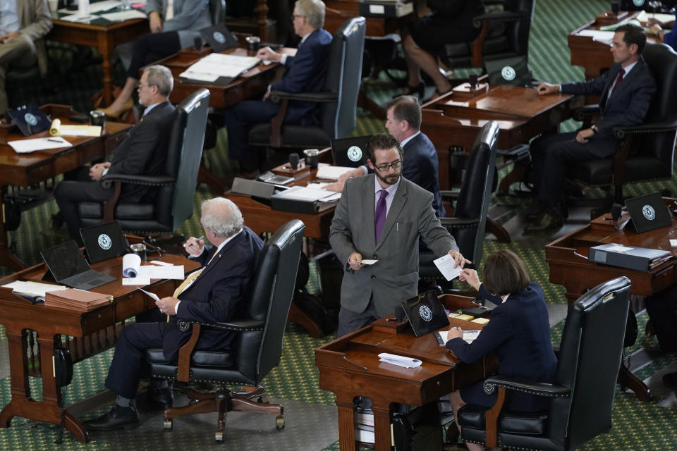 Texas state senators acting as jurors vote on the articles of impeachment against suspended Texas Attorney General Ken Paxton in the Senate Chamber at the Texas Capitol, Saturday, Sept. 16, 2023, in Austin, Texas. (AP Photo/Eric Gay)