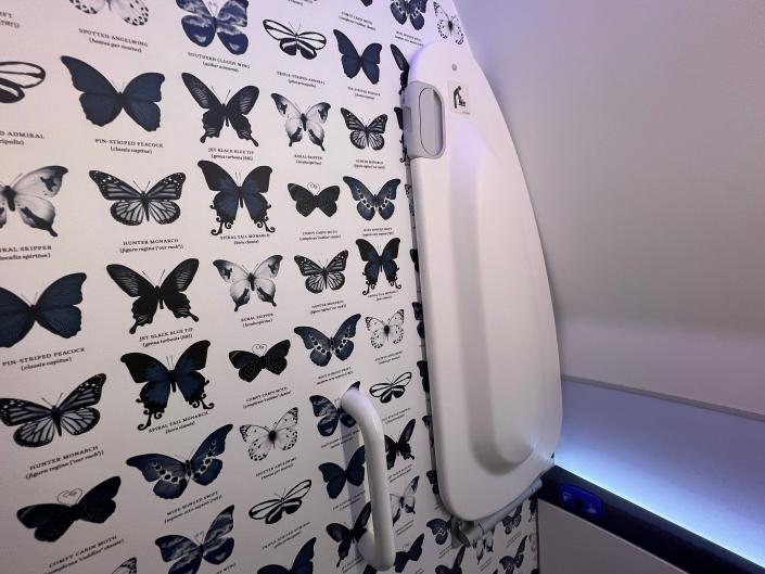 Butterfly wallpaper in the lavatory.