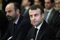 French President Emmanuel Macron, right, and French Prime Minister Edouard Philippe meet with representatives of trade unions, employers' organizations and local elected officials at the Elysee Palace in Paris, Monday, Dec.10 2018. Macron is preparing to speak to the nation Monday at last, after increasingly violent and radicalized protests against his leadership and a long silence that aggravated the anger. (Yoan Valat, Pool via AP)