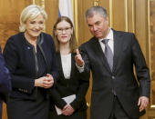 Vyacheslav Volodin, right, welcomes French far-right presidential candidate Marine Le Pen, left, for the talks during their meeting in the Lower House of the Russian Parliament in Moscow, Russia, Friday, March 24, 2017. Le Pen has made multiple visits to Russia, as have her father, niece and other members of the National Front, often meeting with Russian legislators. (Anna Isakova /Photo service of the State Duma Pool Photo via AP)