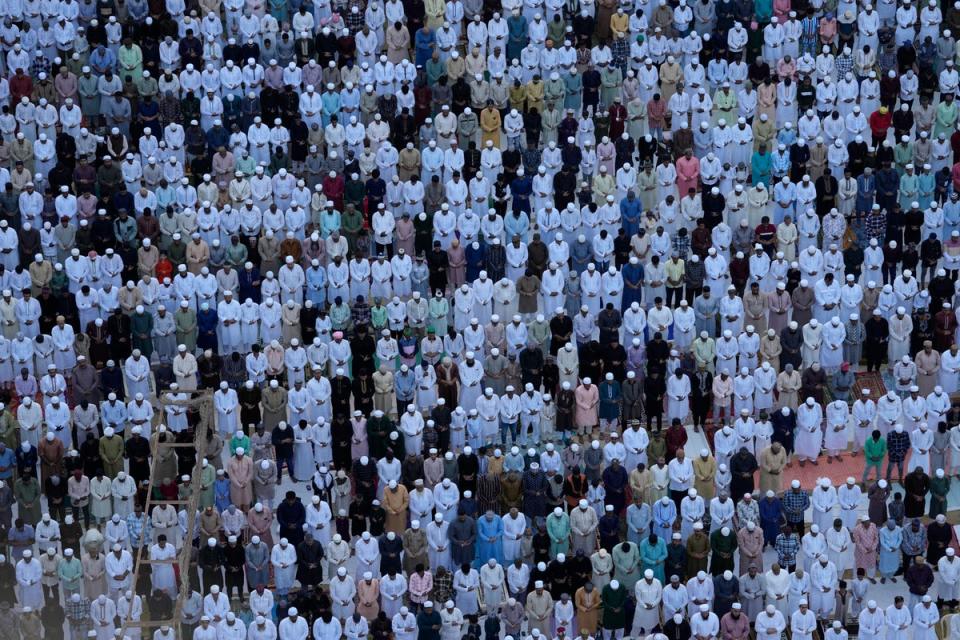 Muslims offer Eid prayers marking the end of the fasting month of Ramadan in Mumbai, India (AP)