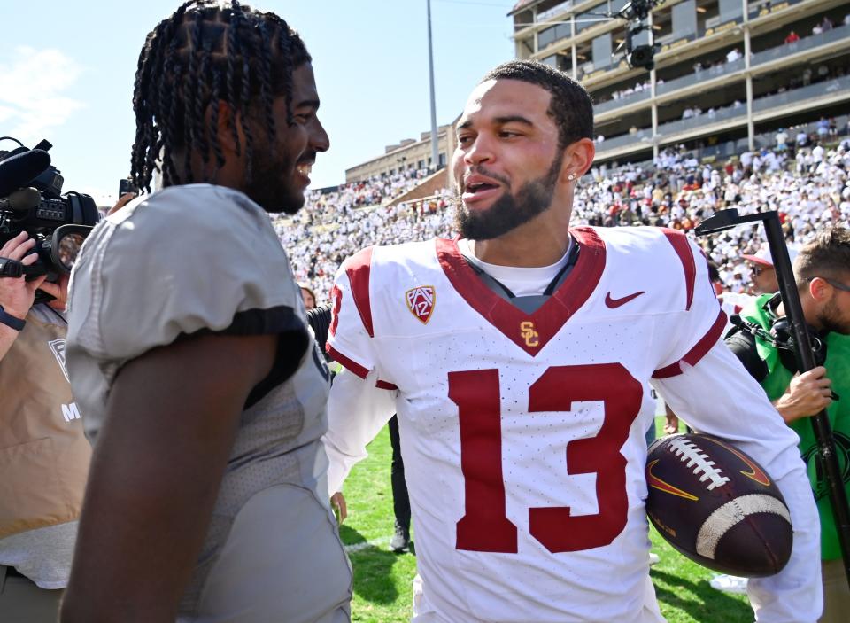 Colorado Buffaloes quarterback Shedeur Sanders (2) meets with USC Trojans quarterback Caleb Williams (13) after the game at Folsom Field in Boulder on Sept. 30, 2023.
