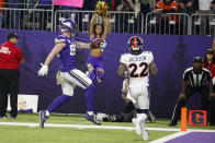 Minnesota Vikings tight end Kyle Rudolph catches a 32-yard touchdown pass in front of Denver Broncos strong safety Kareem Jackson (22) during the second half of an NFL football game, Sunday, Nov. 17, 2019, in Minneapolis. (AP Photo/Bruce Kluckhohn)