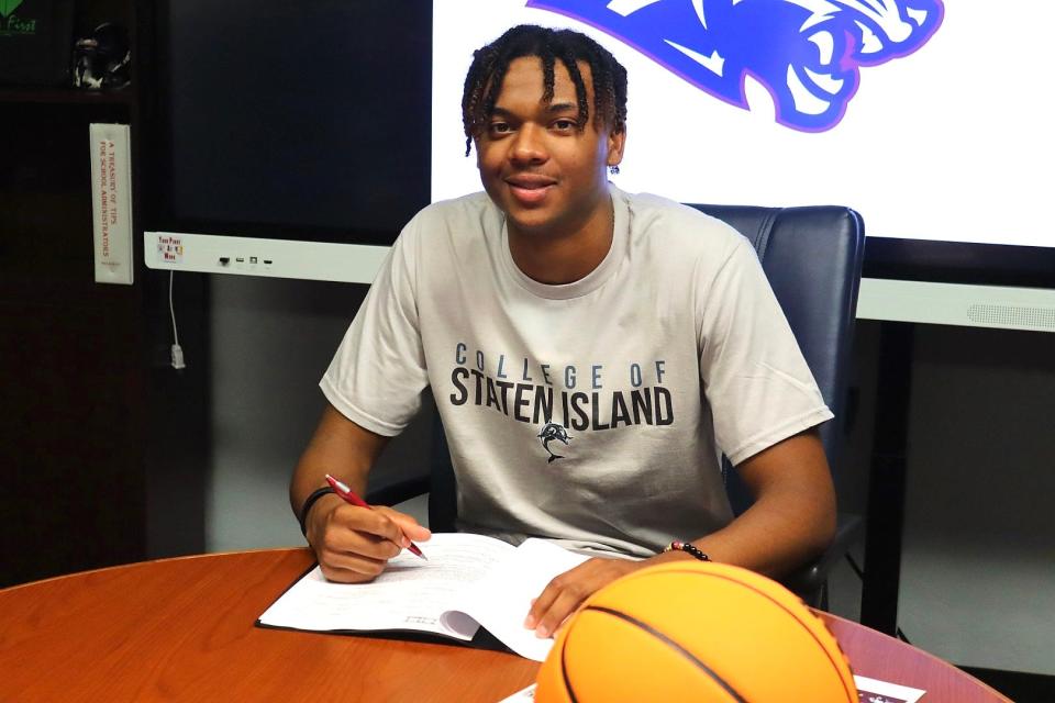 Dwyer basketball star Blake Wilson signed his Letter of Intent with the College of Staten Island on Friday.