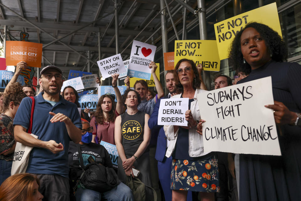 Protesters demonstrate outside New York Gov. Kathy Hochul's Manhattan office, Wednesday, June 5, 2024, in New York. Hochul is indefinitely delaying implementation of a plan to charge motorists big tolls to enter the core of Manhattan, just weeks before the nation's first "congestion pricing" system was set to launch. (AP Photo/Yuki Iwamura)