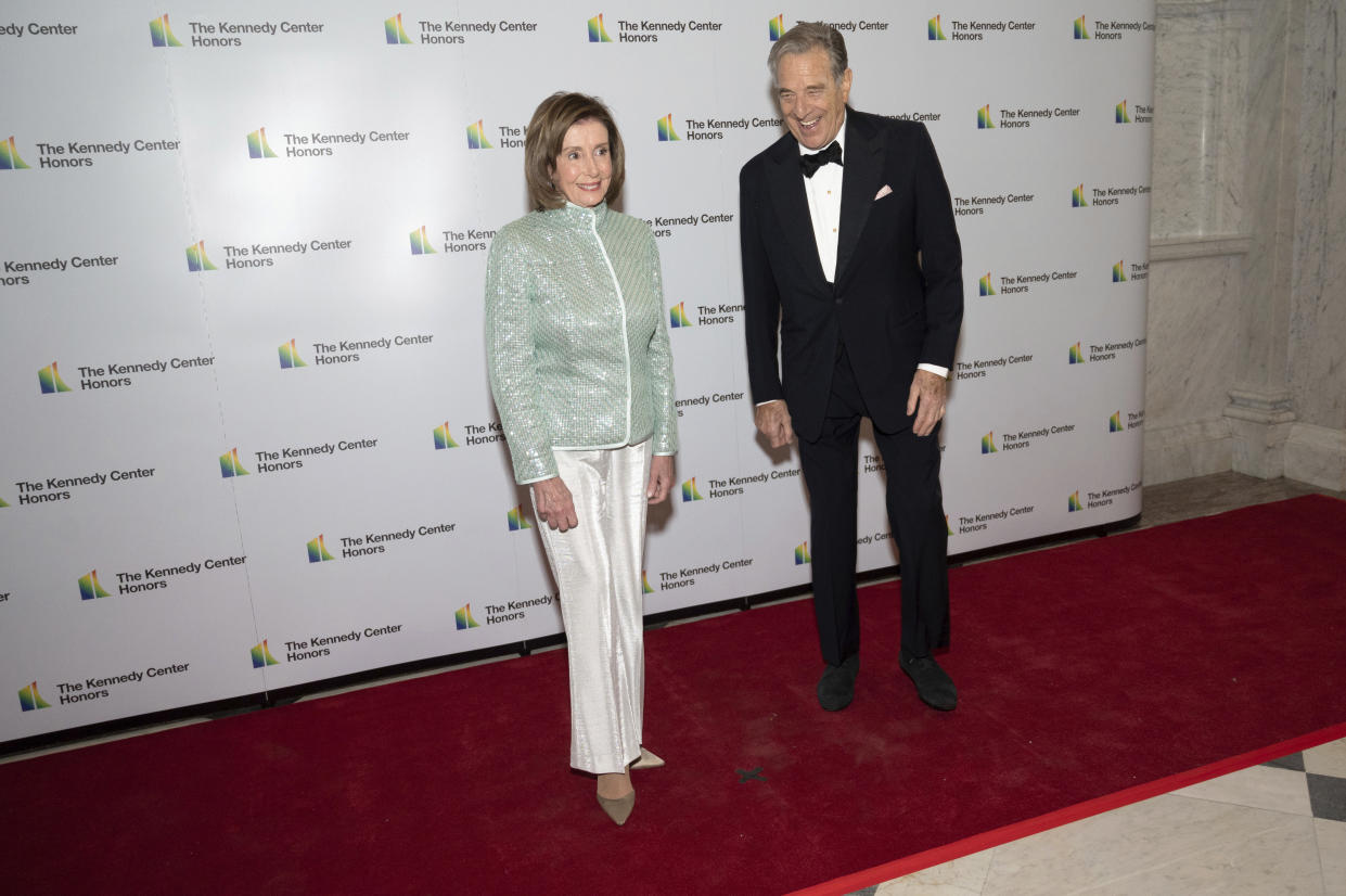 FILE - House Speaker Nancy Pelosi, D-Calif., and her husband, Paul Pelosi, pose on the red carpet at the Medallion Ceremony for the 44th Annual Kennedy Center Honors on Saturday, Dec. 4, 2021, at the Library of Congress in Washington. Authorities say Paul Pelosi was arrested on suspicion of DUI in Northern California, late Saturday, May 28, 2022, in Napa County. He could face charges including driving under the influence. Bail was set at $5,000. (AP Photo/Kevin Wolf)