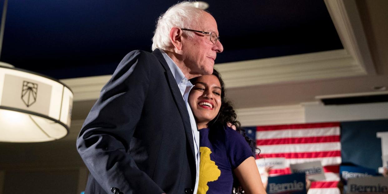 Democratic presidential candidate Sen. Bernie Sanders, I-Vt., left, is welcomed to the stage by Sunrise Movement co-founder Varshini Prakash, right, at a climate rally with the Sunrise Movement at The Graduate Hotel, Sunday, Jan. 12, 2020, in Iowa City, Iowa.