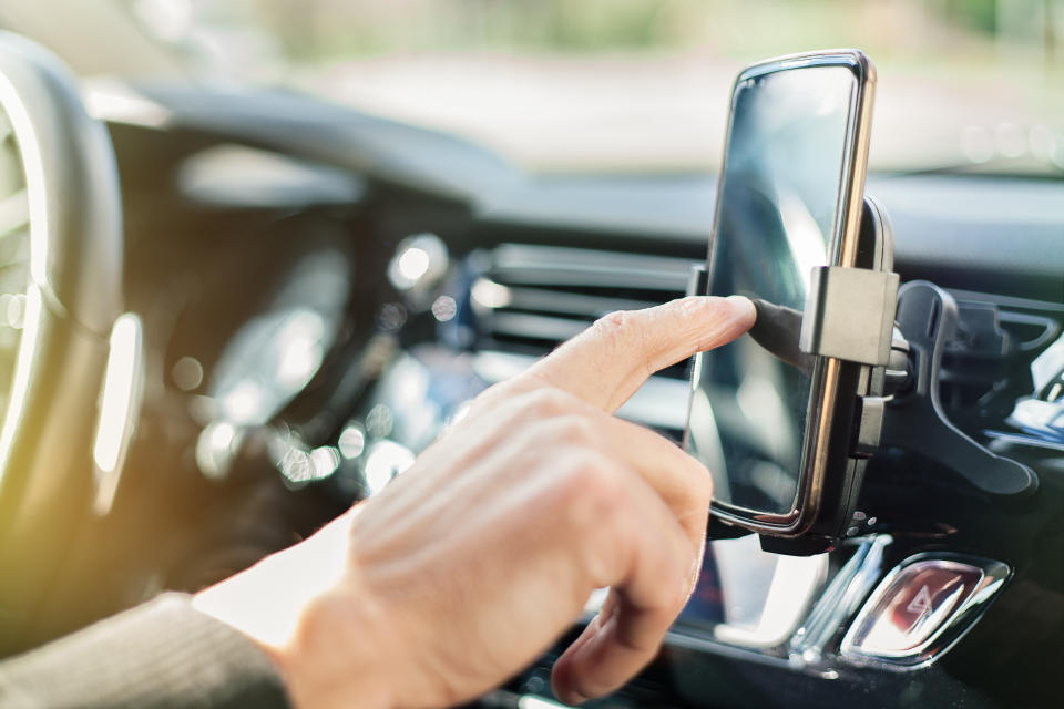 The committee of MPs said hands-free usage posed the same risk of collision as handheld devices (Picture: Getty)