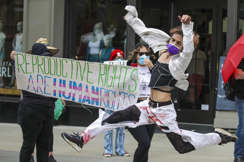 Xodiac, of Queer XACT, dances at an abortion-rights rally at Planned Parenthood-Santa Monica Health Center on Saturday.