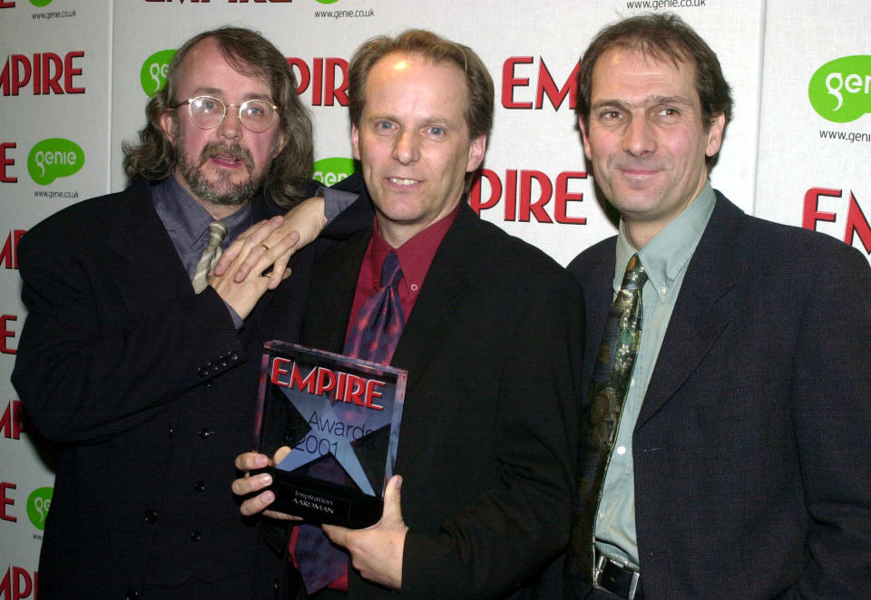 From left, animators Peter Lord, Nick Park and Dave Sproxton, who made the film Chicken Run, with their 2001 Empire Film Award for Inspiration at the Dorchester Hotel in London.   (Photo by Matthew Fearn - PA Images/PA Images via Getty Images)