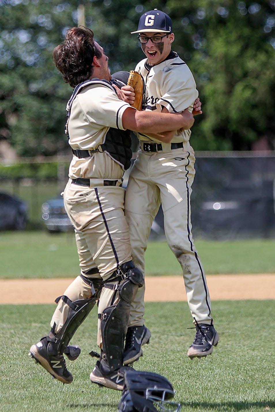 Galesburg junior pitcher Charlie Lardi, right, is embraced by senior catcher Kannon Kleine after Lardi's complete game one-hit performance, leading the Silver Streaks to a 10-0 win over Streator in the Class 3A regional championship game on Saturday, May 28, 2022 at Jim Sundberg Field.