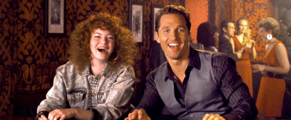 An old flame (Emma Stone) is one of three exes who appear to a womanizer (Matthew McConaughey) to change his ways in "Ghosts of Girlfriends Past."