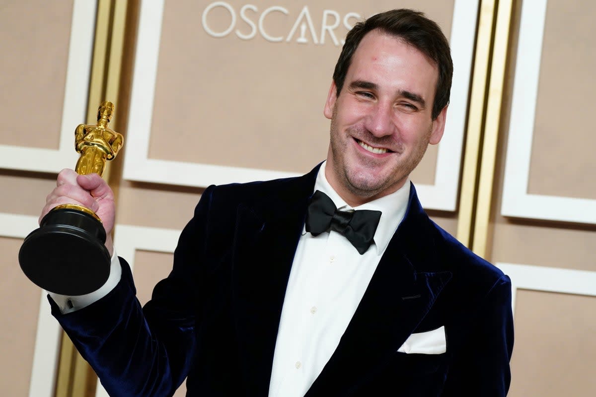 James Friend holds the Academy Awards for best cinematography for All Quiet on the Western Front (AP)