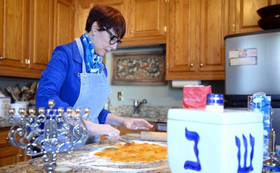 Darrie Schlesinger, wife of retired Rabbi Larry Schlesinger, rolls out dough to make rugelach, a traditional dish to celebrate Hanukkah in the Schlesinger family, on Nov. 28.