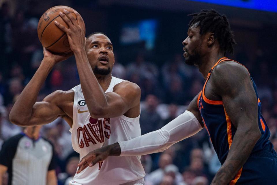 Cleveland Cavaliers'  Evan Mobley (4) looks to shoot as New York Knicks'  Julius Randle (30) defends during the first half of Game 5 Wednesday, April 26, 2023, in Cleveland.