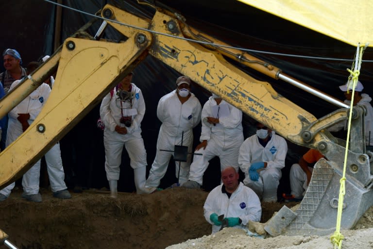 Forensic medical personnel exhume 116 bodies found in a mass grave at Tetelzingo community in Morelos State, Mexico on May 23, 2016