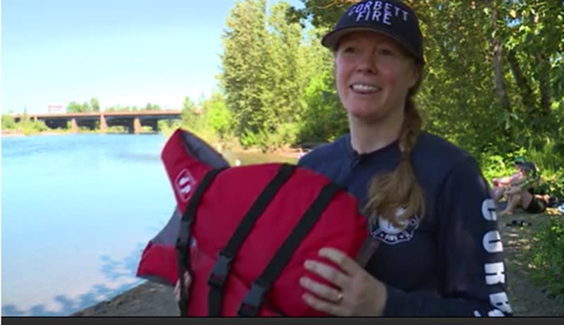 Lt. Jasmine Zimmer Stucky holds a life jacket along the Sandy River, May 11, 2024 (KOIN)