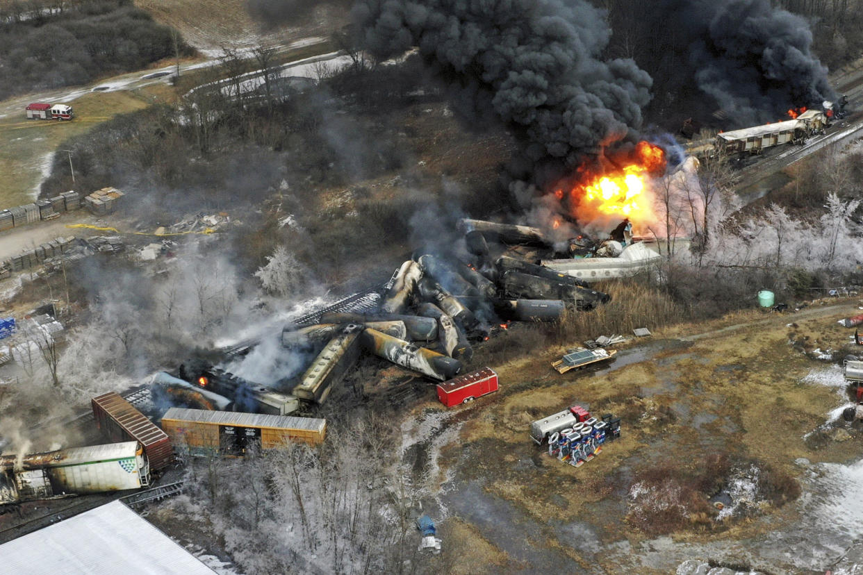 This photo taken with a drone shows portions of a Norfolk and Southern freight train that derailed Friday night in East Palestine, Ohio are still on fire at mid-day Saturday, Feb. 4, 2023.  (Gene J. Puskar / AP)