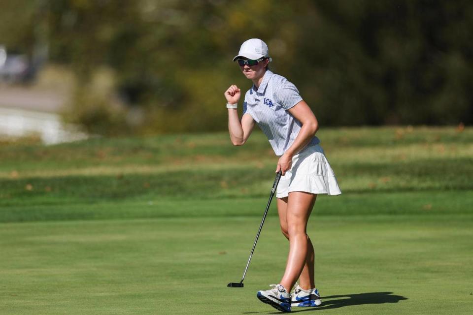 Lexington Christian’s C.A. .Carter celebrates her birdie putt on the 18th hole of the Region 9 Championship girls high school golf tournament at the University Club at Arlington in Richmond on Sept. 19. She finished first in Monday’s State First Round tournament at Winchester Country Club.