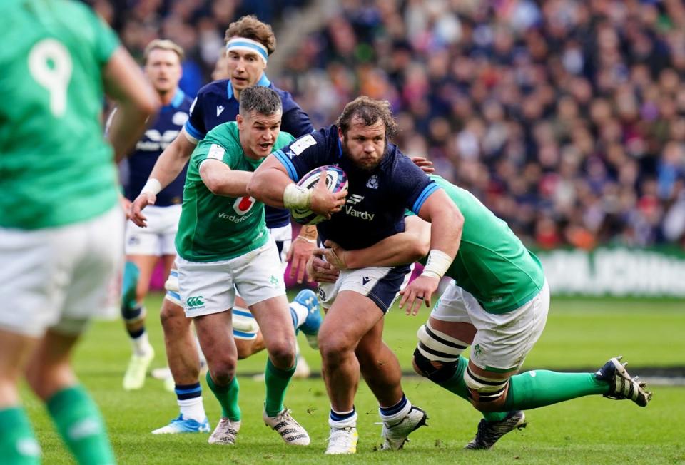 Scotland’s Pierre Schoeman is challenged by two Irish players (PA)