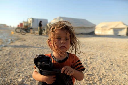 An internally displaced girl who fled Raqqa is pictured at a camp in Ain Issa, north of Raqqa. REUTERS/Zohra Bensemra