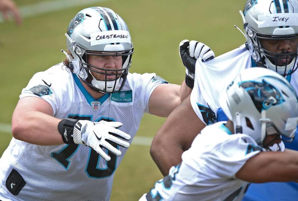 Carolina Panthers rookie tackle Brady Christensen, left, assists on a play during the teamÕs 2021 rookie minicamp practice on Friday, May 14, 2021.