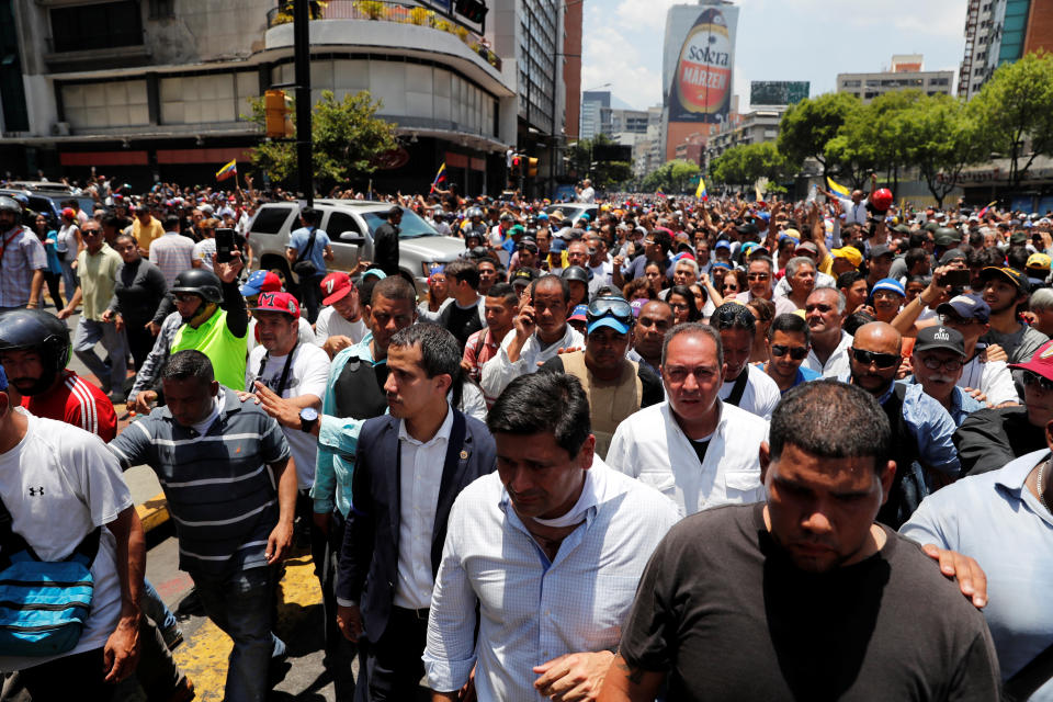 Venezuelan opposition leader Juan Guaido walks with supporters in Caracas