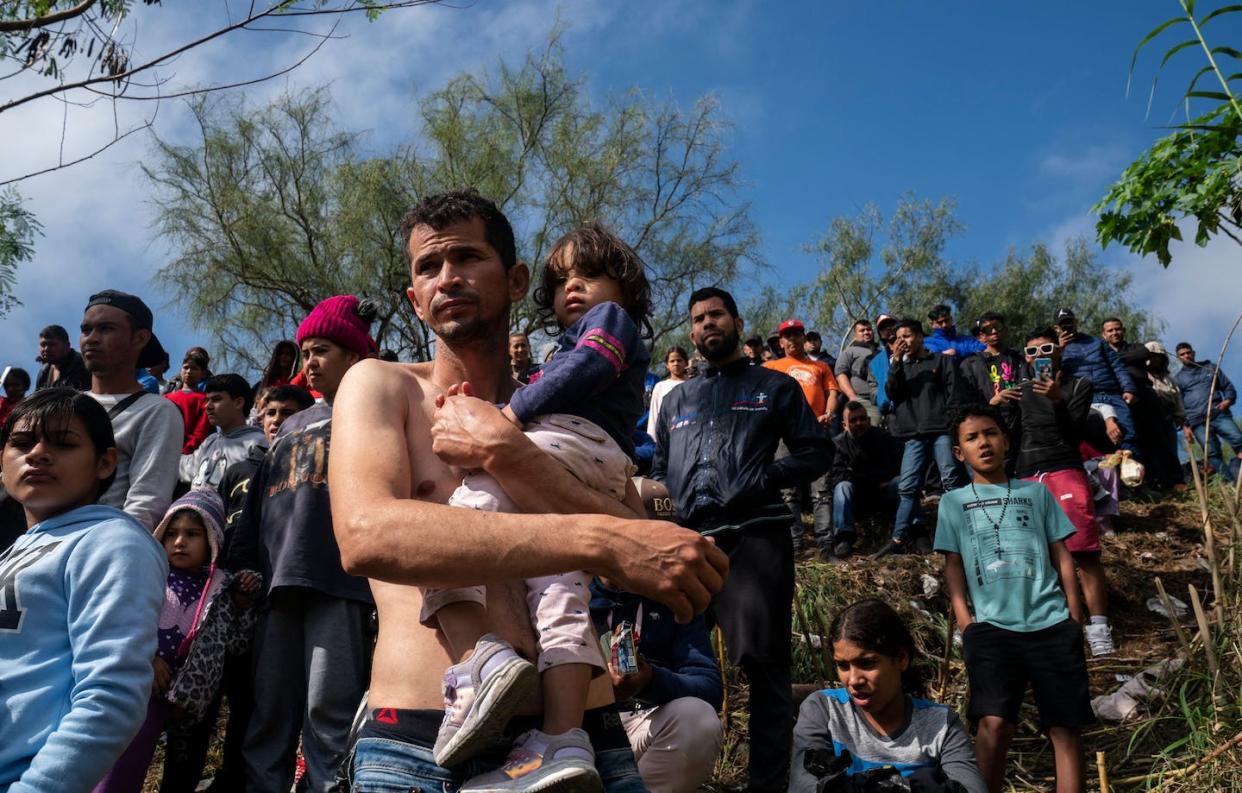 A Venezuelan asylum-seeker carries his daughter before they cross the Rio Grande into Brownsville, Texas. <a href="https://www.gettyimages.com/detail/news-photo/venezuelan-asylum-seeker-jehan-carlo-ramirez-carries-his-news-photo/1245788787?adppopup=true" rel="nofollow noopener" target="_blank" data-ylk="slk:Veronica G. Cardenas/AFP via Getty Images;elm:context_link;itc:0;sec:content-canvas" class="link ">Veronica G. Cardenas/AFP via Getty Images</a>