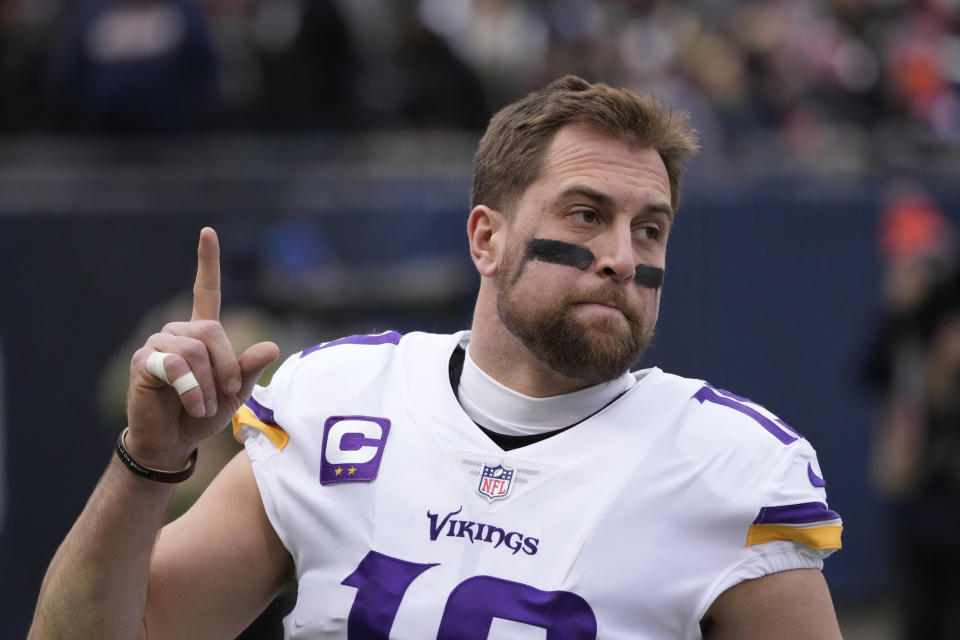 FILE - Minnesota Vikings' Adam Thielen points skyward before an NFL football game against the Chicago Bears Sunday, Jan. 8, 2023, in Chicago. The Vikings released wide receiver Adam Thielen on Friday, March 10, 2023, for salary cap relief, ending a remarkable 10-year run with his home-state team as an undrafted underdog.(AP Photo/Charles Rex Arbogast, File)