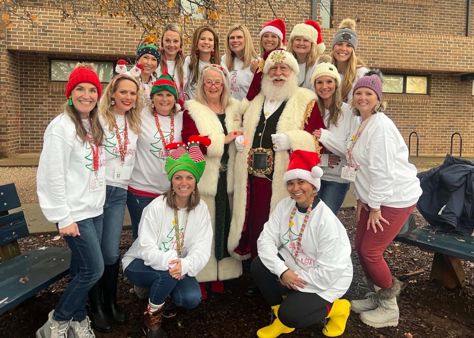 Santa and Mrs. Claus visit with the Farragut Christmas parade committee.