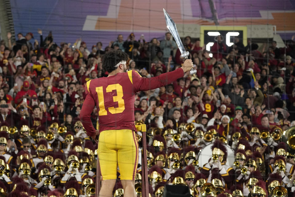 USC quarterback Caleb Williams leads the USC Marching Band after USC defeat UCLA 48-45 on Saturday, Nov. 19, 2022, in Pasadena, Calif. (AP Photo/Mark J. Terrill)