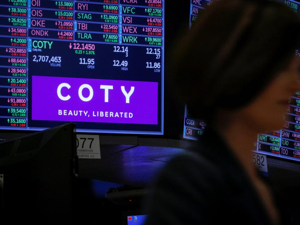 FILE PHOTO: A screen displays the logo and trading information for Coty Inc at the New York Stock Exchange (NYSE) in New York, U.S., November 18, 2019. REUTERS/Brendan McDermid