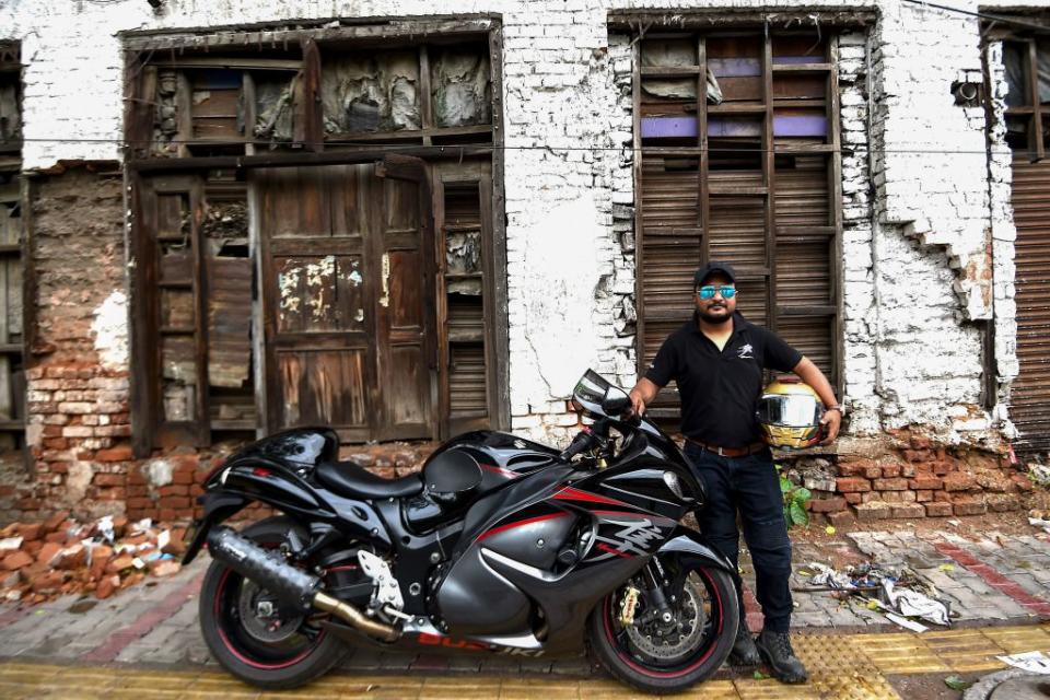 <em>Deus est machina</em>. Pravesh Batra poses with his Suzuki Hayabusa in New Delhi. (Credit: Money Sharma/AFP via Getty Images)