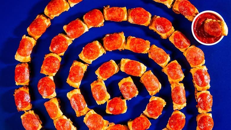 A spiral of bite-size pretzels with pepperoni