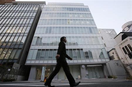 A man walks past a building where Mt. Gox, a digital marketplace operator, is housed in Tokyo February 25, 2014. REUTERS/Toru Hanai
