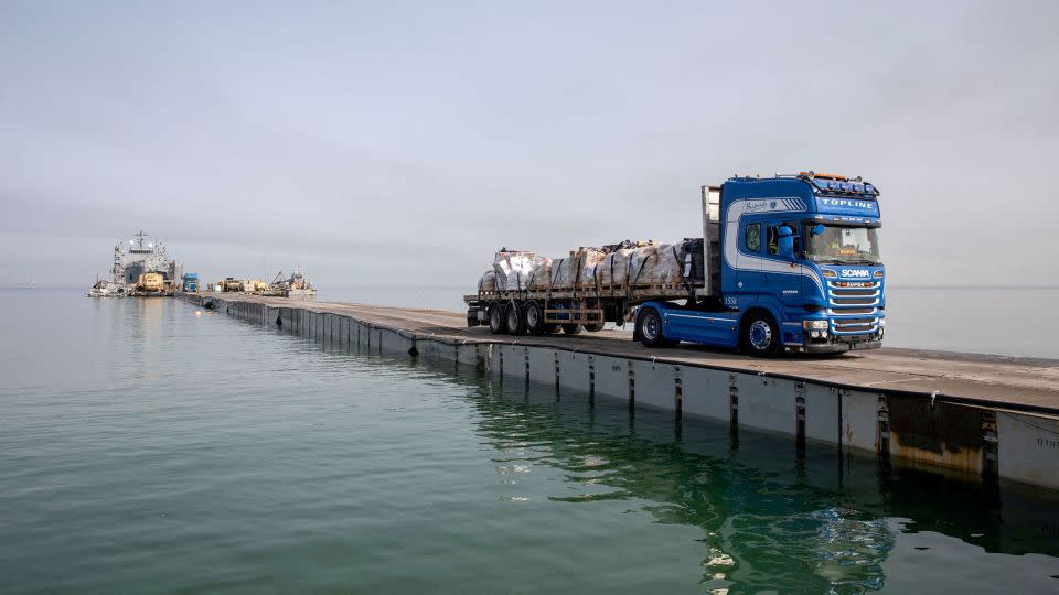 This handout photo shows a truck carrying humanitarian aid across Trident Pier off the Gaza Strip on May 19. - US Army Central/Handout/Reuters