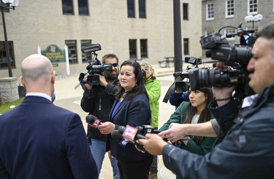 Lee Kindlon, attorney for Nauman Hussain, left, speaks with reporters during a new trial in Schoharie, N.Y., on Monday, May 1, 2023. Judge Peter Lynch, rejected a plea agreement for Hussain, who ran the limousine company involved in the 2018 crash that killed 20 people, to avoid prison time. (AP Photo/Hans Pennink)